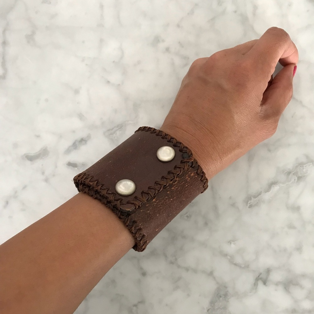 Brown band bracelet with adjustable snap closure